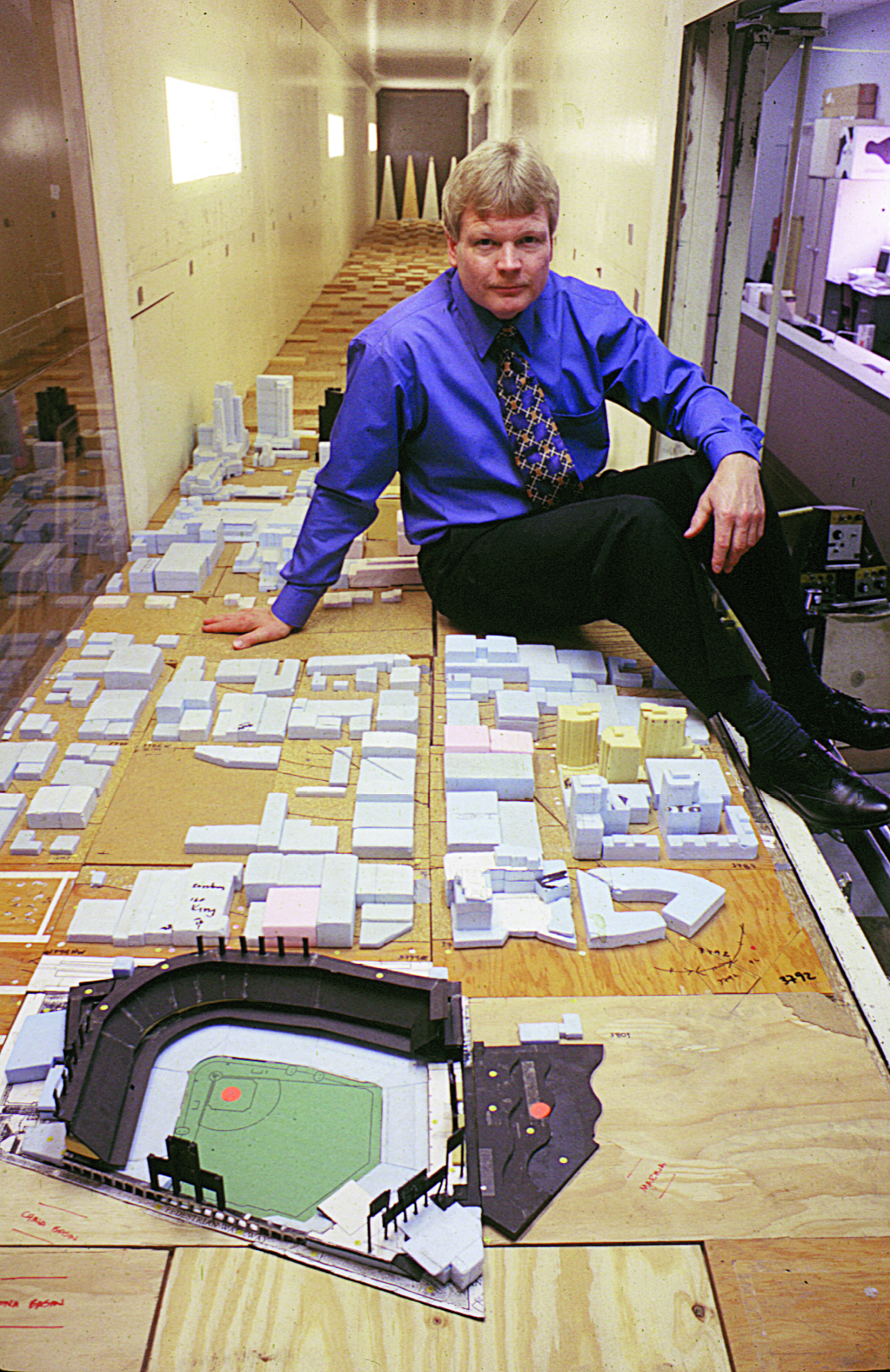 Professor Bruce White sits inside the Atmospheric Boundary Layer Wind Tunnel with 3D models of San Francisco and the then-new Pac Bell Park.