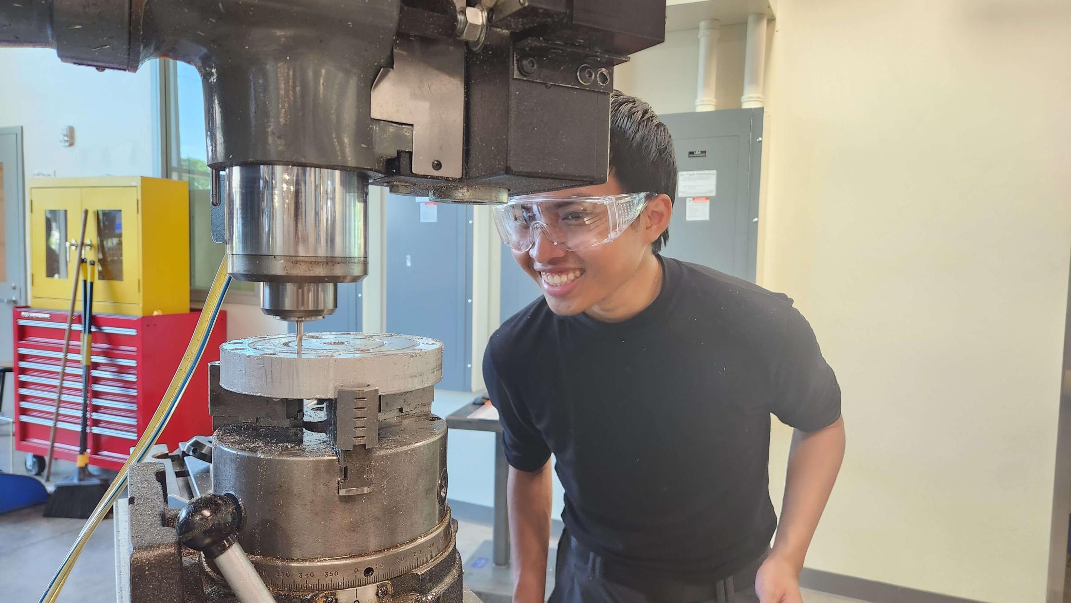 Person operates machinery in lab