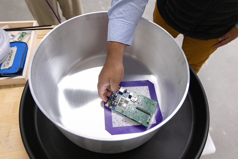 Person loads a microchip into chamber