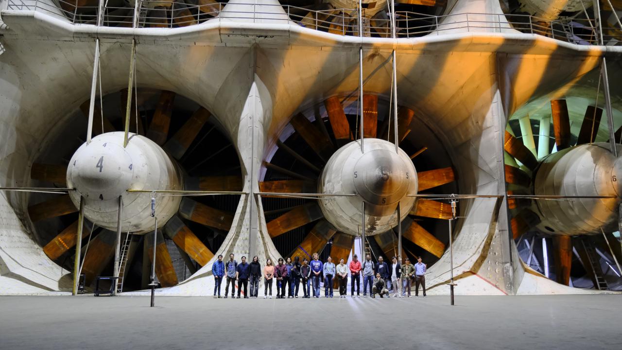 Group photo in front of wind tunnel