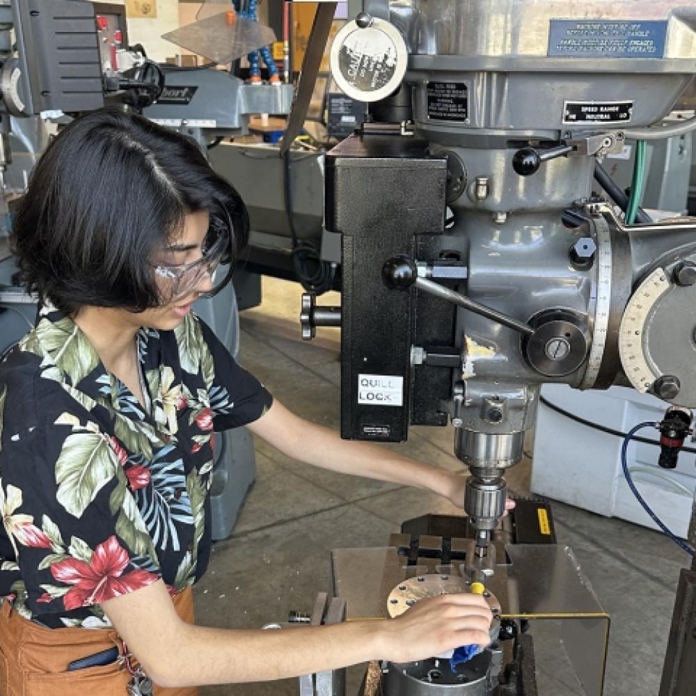 Person operates machinery in lab
