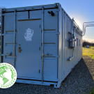 A large white vehicle module shipping container