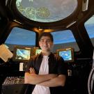 Aidan Guerra stands in the Alpha Dome