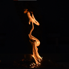 An orange flame in the dark