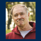 Maury Hull in a red jacket outdoors